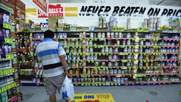 A man looks in the baby formula section of Chemist Warehouse in Campsie. 