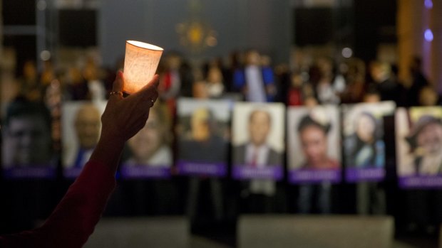 A candle held during a vigil in San Bernardino.