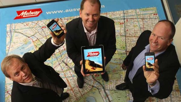 Brothers, from left, David, Dean and Murray Godfrey have helped their father Merv (below) steer his map business through hard times and into a new technology phase.