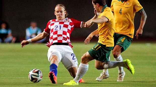 Warming up: Australian Tommy Oar vies for the ball with Croatia's Domagoj Vida.
