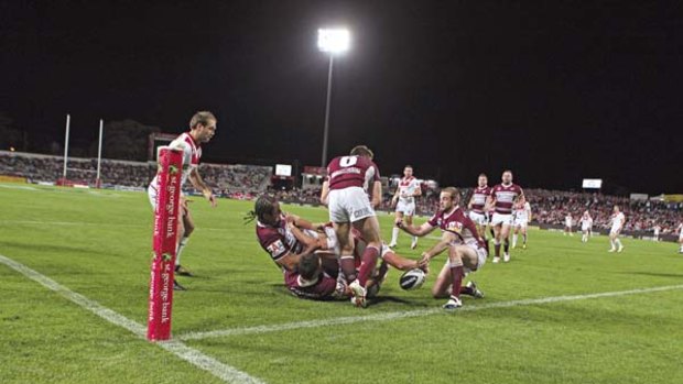 Line ball ... Dragon Mark Gasnier stretches out to score a disputed try against Manly at Jubilee Oval last night.