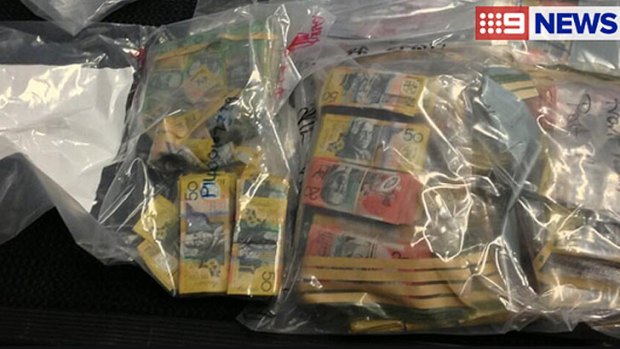 Cash seized in raids by the anti-bikie squad in Brisbane and the Gold Coast.