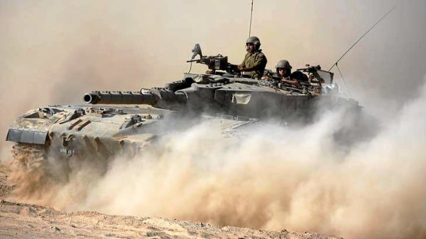 An Israeli Merkava tank rolls near Israel's border with the Gaza Strip this week.