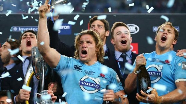 Triumphant Tahs: Michael Hooper celebrates after winning the Super Rugby title.