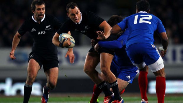 Israel Dagg of New Zealand charges on.