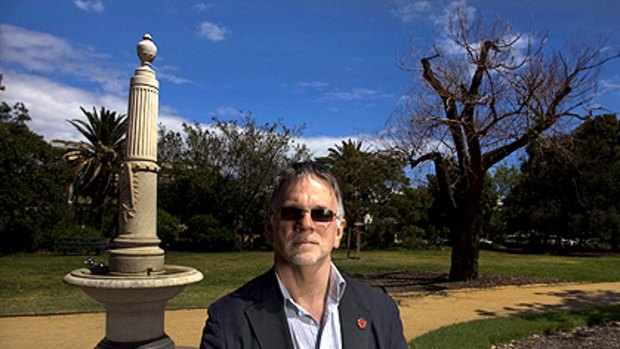 Historian Garrie Hutchinson in front of the Charles Moore Boer War memorial in Albert Park. Charlie Moore, who played 30 games for Essendon, was the first VFL player killed in war.