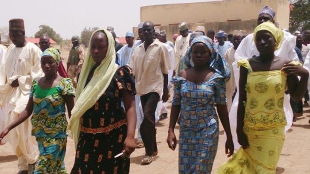 Brave escape ... these four female students of the Government Girls Secondary School in Chibok managed to escape from the Islamist gunmen who abducted them. 230 schoolgirls are still missing, according to the principal.