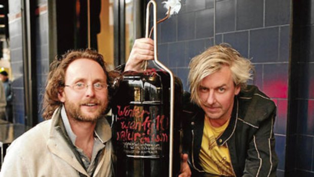 Tom Shobbrook left and Sam Hughes, with their Voice of the People, a 27-litre drum of wine with no additives. Olive oil floats on top to prevent oxidation as the level falls.  Photo: Marco Del Grande
