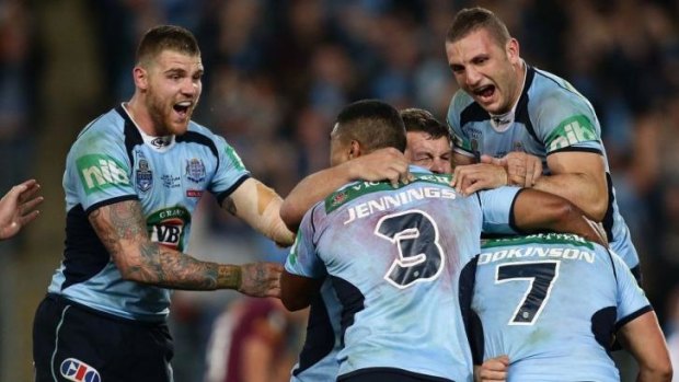Joyous: NSW Blues celebrate after Hodkinson's match-winning play.
