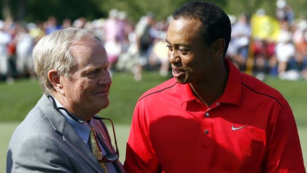 Winner ... Tiger Woods is congratulated by Jack Nicklaus.