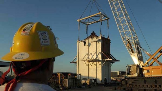 Workers put the finishing touches on the Pollution Control Dome at the Martin Terminal work site in Port Fourchon, as BP rushes to cap the source of the oil slick from the BP Deepwater Horizon platform disaster in Louisiana.