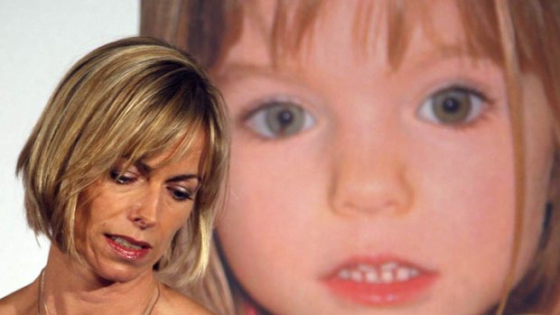Kate McCann stands in front of a picture of her daughter, Madeleine, who went missing during a family holiday to Portugal in 2007.