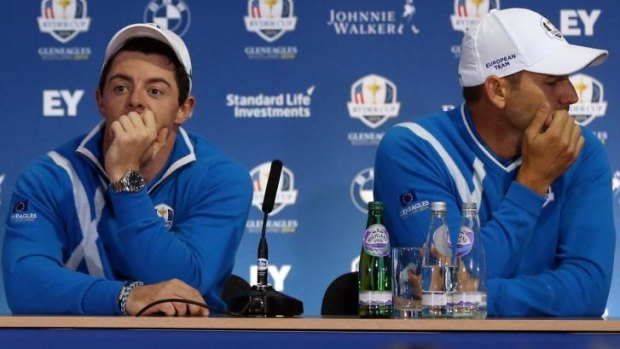 Disappointed: Rory McIlroy and Sergio Garcia lament their poor showing against Phil Mickelson and Keegan Bradley, losing in the fourballs.