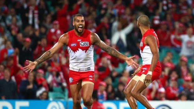 Four stars: Lance Franklin celebrates one of his four goals for the Swans in a stirring performance.