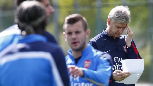 Headache: Arsene Wenger at training as Arsenal prepared for the FA Cup.