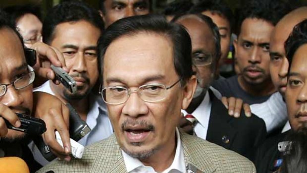 Mr Anwar Ibrahim speaks to the media before his arrest today.