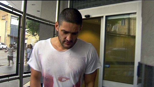 Fallen AFL star player Brendan Fevola leaving the Brisbane lock-up after being arrested on New Year's Day.