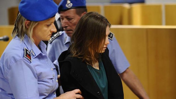 Spent four years in jail ... Amanda Knox is taken into court to hear the verdict.