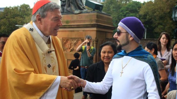 Meet the congregation ... Cardinal George Pell greets Con Ditsas outside St Mary's Cathedral after Easter Sunday morning Mass.