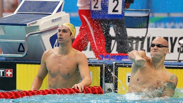 Smashed ... Canadian Brent Hayden, right, won the 100 metres freestyle.