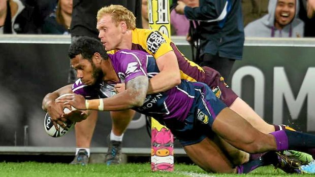 Try time: Sisa Waqa of the Storm carries Peter Wallace over the line.