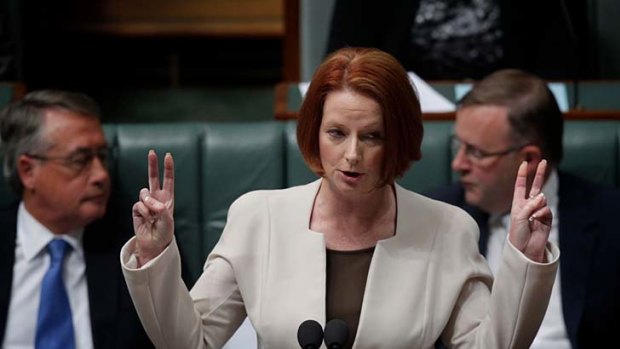 The Vs have it: Julia Gillard pictured during question time yesterday.