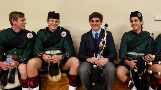 ''I've had people come up and tell me it's made their day'' &#8230; Lachlan Micati from Westfields Sports High school, centre, with the bagpipes band from The Scots College.