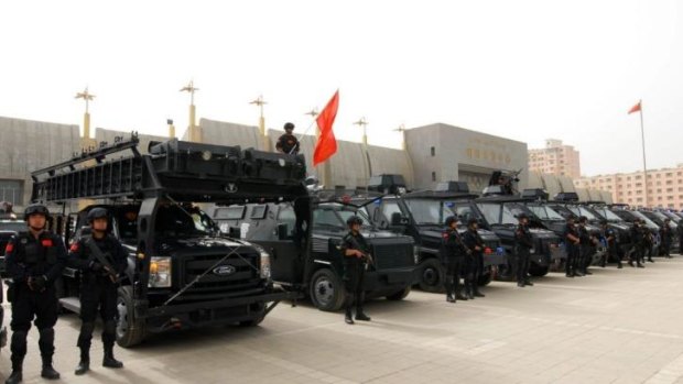 Security forces participate in a military drill in Xinjiang.