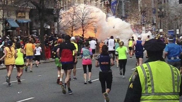 Tragedy: The explosion erupts near the finish line of the marathon last year.