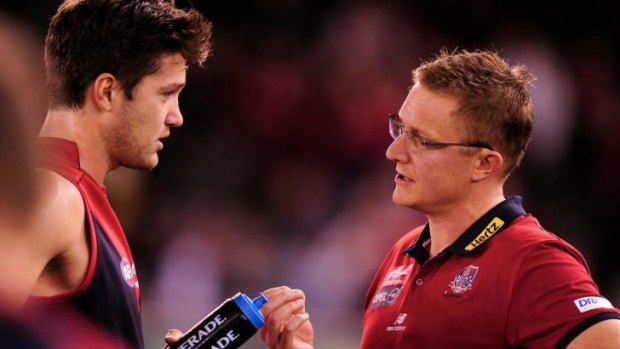 Martin being spoken to by former Melbourne coach Mark Neeld in 2012.