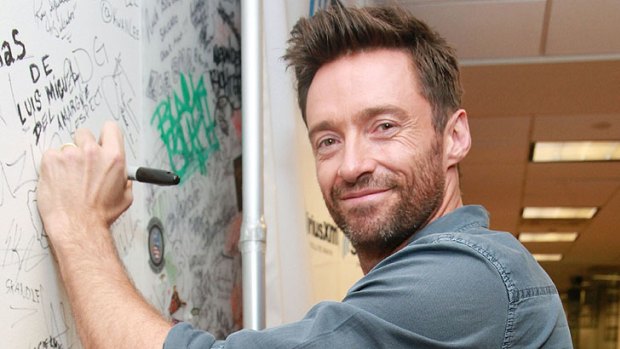 Signing on again ... Hugh Jackman in New York.