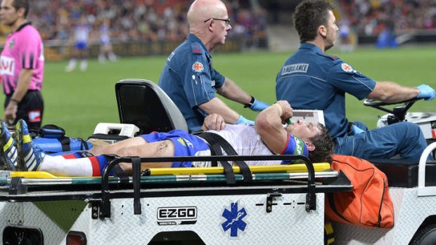 Painful end: Kurt Gidley is taken from the field on a medicab after injuring his foot against Brisbane at Suncorp Stadium last Friday night. He won't play again this season.
