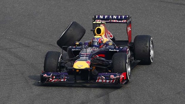 Tyresome: Mark Webber's Chinese Grand Prix is over after losing a wheel.
