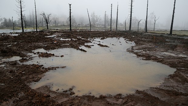 Rain water pools on Monday where a neighbourhood once stood in Santa Rosa, California.