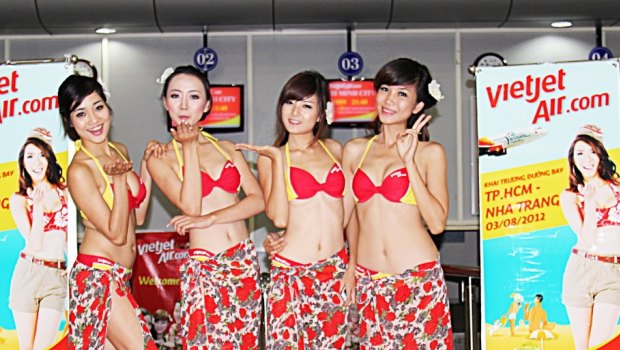 VietJet is known for its young flight attendants who wear bikinis on inaugural flights to beach locations.