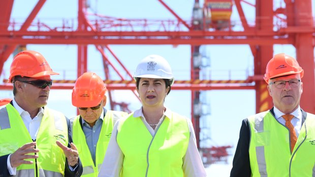 Queensland Premier Annastacia Palaszczuk (centre) and Local Government Association of Queensland president Mark Jamieson (right) are seen at the Port of Brisbane on Wednesday.