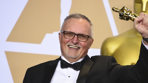 Australian film editor Lee Smith poses with his Oscar.