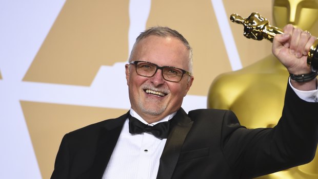 Australian film editor Lee Smith poses with his Oscar.