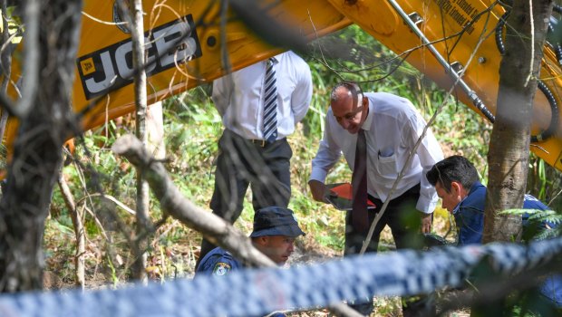 Matthew Leveson's former boyfriend Michael Atkins leading NSW Police to search an area of the Royal National Park, near Waterfall.