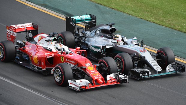 Not an inch: Vettel and Hamilton racing side-by-side.