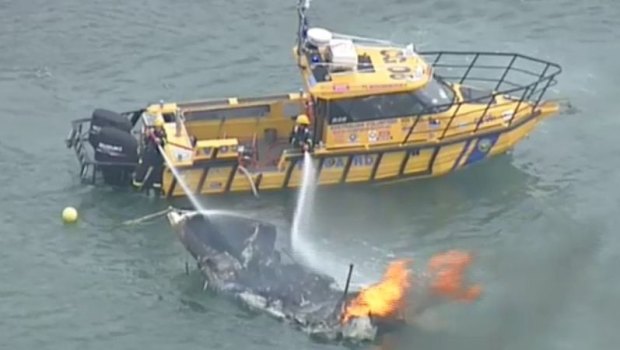 Police are still hunting a man after a mysterious boat fire at Blairgowrie Beach on Victoria's Mornington Peninsula on Australia Day.