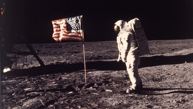 Astronaut Edwin "Buzz" Aldrin poses for a photograph beside the US flag planted on the moon during the Apollo 11 mission on July 20, 1969. 