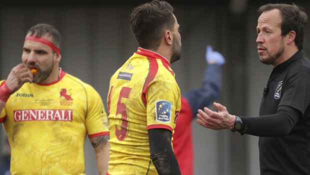 Controversy: Spain's Charlie Malie  argues with Romanian referee Vlad Iordaschescu.