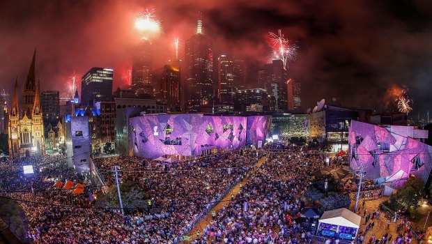 The midnight fireworks display, seen from Federation Square, lights up the city skyline during last year's New Year's Eve celebrations.