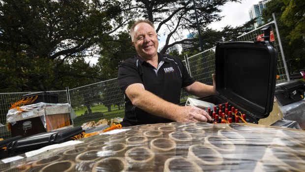 Rusty Johnson in Flagstaff Gardens with some of the fireworks that will be used in Melbourne's New Years Eve pyrotechnic display.