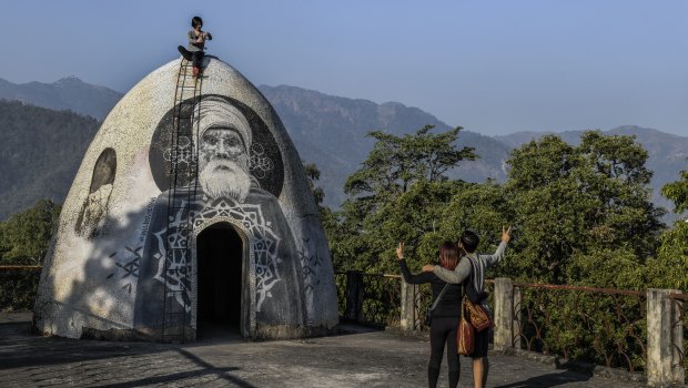 Visitors at a meditation pod on the roof of the ashram formerly run by Maharishi Mahesh Yogi, where members of the legendary band The Beatles famously stayed in 1968, in Rishikesh, India. 