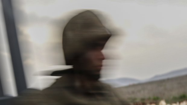 A Turkish soldier secures the border with Syria, in the outskirts of the border town of Kilis, on Saturday.