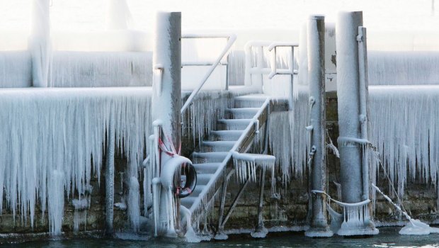 Ice covers the pier at the harbour of Constance at lake Constance, Germany.