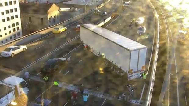 A truck has jack-knifed blocking lanes and causing chaos on the West Gate Freeway. 
