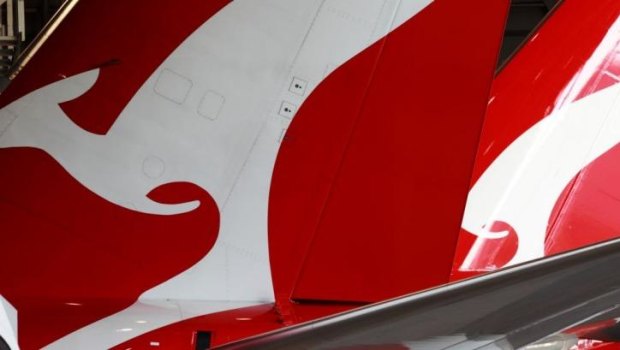 Qantas has reported a record high half-year profit. 